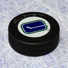 Cesare Maniago Vancouver Canucks Autographed Hockey Puck | AJ Sports.